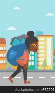 An african-american woman walking with a big backpack full of different devices on a city background vector flat design illustration. Vertical layout.. Woman with backpack full of devices.