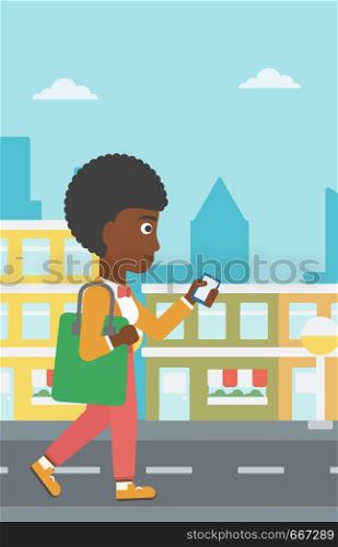 An african-american woman walking with a smartphone on a city background vector flat design illustration. Vertical layout.. Woman walking with smartphone.
