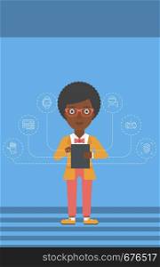 An african-american woman with a tablet computer and some icons connected to the device on a light blue background vector flat design illustration. Vertical layout.. Woman holding tablet computer.