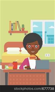 An african-american woman working on laptop while eating junk food on the background of bedroom vector flat design illustration. Vertical layout.. Woman eating hamburger.