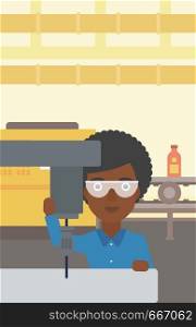 An african-american woman working on milling machine at workshop. Woman using milling machine at factory. Woman making a hole using a milling machine. Vector flat design illustration. Vertical layout.. Woman working on milling machine.
