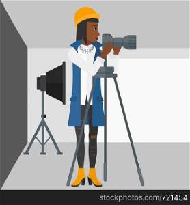 An african-american woman working with camera on the background of photo studio with lighting equipment vector flat design illustration. Square layout.. Photographer working with camera on a tripod.