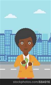 An african-american young business woman putting money in her pocket on a city background. Vector flat design illustration. Vertical layout.. Woman putting money in pocket vector illustration.