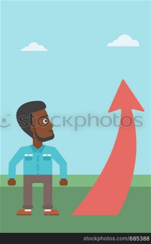 An african-american young businessman looking at a red arrow going up. Successful business concept. Vector flat design illustration. Vertical layout.. Businessman looking at arrow going up.