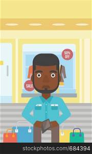 An african-american young man showing his wallet purse on the background of showcase of a store. Vector flat design illustration. Vertical layout.. Man showing epmty wallet vector illustration.