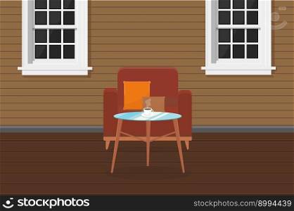 an armchair chairs and a table with coffee on the veranda of the house with windows terrace cafe. armchair chairs and a table with coffee on the veranda of the house with windows terrace cafe