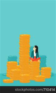 An asian business woman sitting on stack of golden coins and looking up to the biggest one on a blue background vector flat design illustration. Vertical layout.. Business woman sitting on gold.