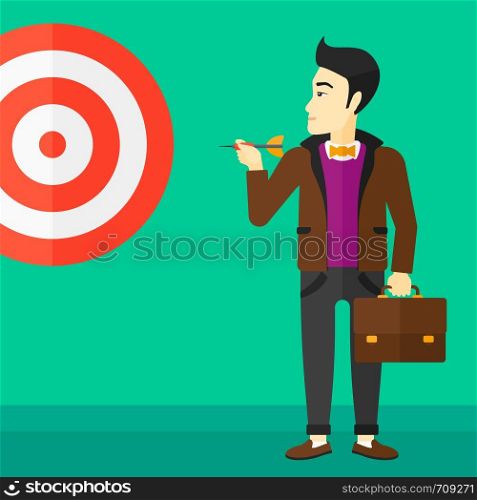 An asian businessman standing with arrow in hand and aiming at a target board on a green background vector flat design illustration. Square layout.. Businessman with target board.