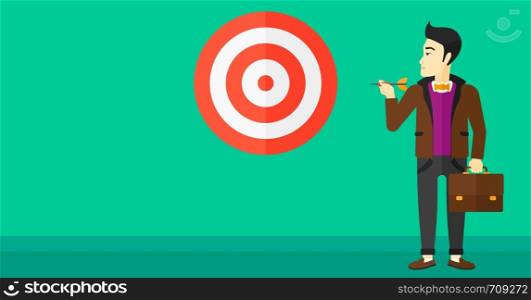 An asian businessman standing with arrow in hand and aiming at a target board on a green background vector flat design illustration. Horizontal layout.. Businessman with target board.