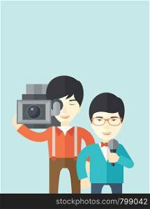 An asian cameraman filming a reporter vector flat design illustration isolated on blue background. Vertical layout.. TV report.