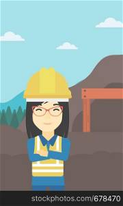 An asian confident coal miner. Female miner standing in front of a big mining equipment on the background of coal mine. Vector flat design illustration. Vertical layout.. Miner with mining equipment on background.