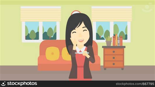 An asian delighted woman looking at positive pregnancy test on the background of living room. Young woman checking pregnancy test. Vector flat design illustration. Horizontal layout.. Woman with pregnancy test.