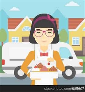 An asian female baker holding a box of cakes. A baker delivering cakes. Baker with cupcakes standing on the background of delivery truck. Vector flat design illustration. Square layout.. Baker delivering cakes vector illustration.