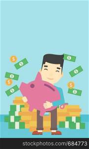 An asian happy young businessman holding a big piggy bank in hands under money rain on the background of stacks of gold coins. Vector flat design illustration. Vertical layout.. Businessman with piggy bank vector illustration.