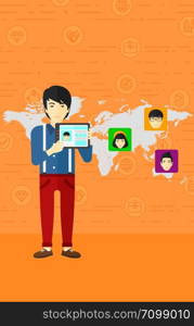 An asian man holding a tablet computer and avatars on the map behind him on an orange background with business icons vector flat design illustration. Vertical layout.. Man holding tablet computer with social media source.