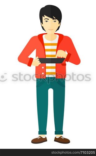 An asian man holding a tablet computer in hands vector flat design illustration isolated on white background. . Man using tablet computer.