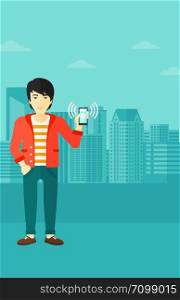An asian man holding vibrating smartphone on a city background vector flat design illustration. Vertical layout.. Man holding ringing telephone.