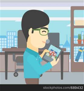 An asian man looking at house on a digital tablet screen. Young man standing in office and looking for house on tablet computer. Vector flat design illustration. Square layout.. Man looking for house vector illustration.