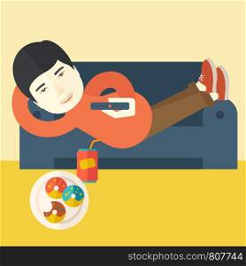 An asian man lying on a sofa holding a remote with three donuts on the plate and soda on the floor vector flat design illustration. Square layout.. Man lying on sofa.