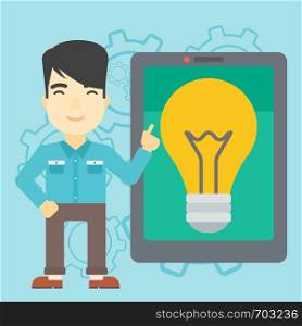 An asian man pointing at a big tablet computer. Man standing near tablet computer with a light bulb on a screen. Vector flat design illustration. Square layout.. Man pointing at big tablet computer.