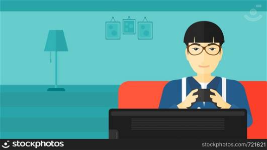 An asian man sitting on a sofa with gamepad in hands on a living room background vector flat design illustration. Horizontal layout.. Addicted video gamer.