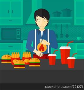An asian man standing in the kitchen in front of table full of junk food and suffering from heartburn vector flat design illustration. Square layout.. Man suffering from heartburn.