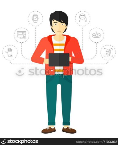 An asian man standing with a tablet computer and some icons connected to the laptop vector flat design illustration isolated on white background. . Man holding tablet computer.