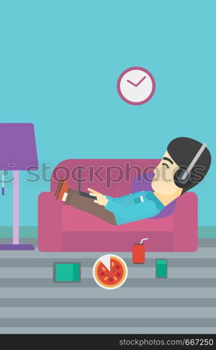 An asian man with belly relaxing on a sofa with many gadgets. Man lying on a sofa surrounded by gadgets. Man using gadgets at home. Vector flat design illustration. Vertical layout.. Man lying on sofa with many gadgets.