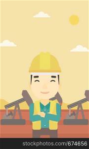 An asian oil worker in uniform and helmet. An oil worker with crossed arms. An oil worker standing on a background of pump jack. Vector flat design illustration. Vertical layout.. Cnfident oil worker vector illustration.