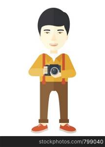 An asian photographer holding a camera vector flat design illustration isolated on white background. Vertical layout.. Photographer.