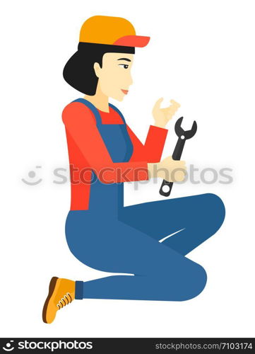 An asian repairer sitting with a spanner in hand vector flat design illustration isolated on white background. . Repairer holding spanner.