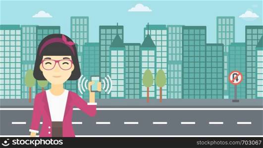 An asian woman holding ringing mobile phone on a city background. Woman answering a phone call. Woman with ringing phone in hand. Vector flat design illustration. Horizontal layout.. Woman holding ringing telephone.
