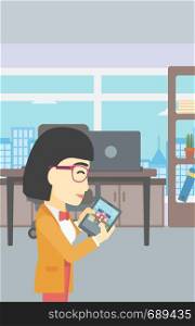 An asian woman looking at house on a digital tablet screen. Young woman standing in office and looking for house on tablet computer. Vector flat design illustration. Vertical layout.. Woman looking for house vector illustration.
