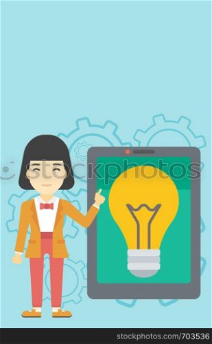An asian woman pointing at a big tablet computer. Woman standing near a big tablet computer with a light bulb on a screen. Vector flat design illustration. Vertical layout.. Woman pointing at big tablet computer.