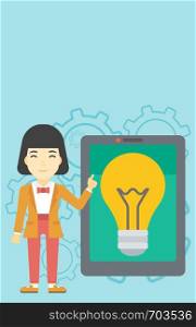 An asian woman pointing at a big tablet computer. Woman standing near a big tablet computer with a light bulb on a screen. Vector flat design illustration. Vertical layout.. Woman pointing at big tablet computer.
