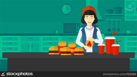 An asian woman standing in the kitchen in front of table full of junk food and suffering from heartburn vector flat design illustration. Horizontal layout.. Woman suffering from heartburn.