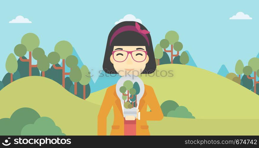 An asian woman standing on the background of green forest and holding in hands a big lightbulb with trees inside. Green energy concept. Vector flat design illustration. Horizontal layout.. Woman with lightbulb and trees inside.