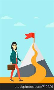 An asian woman with a suitcase in hand standing on a road leading to the top of the mountain with a flag on the background of blue sky vector flat design illustration. Vertical layout.. Cheerful leader woman.