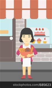 An asian young female baker holding basket with bakery products. Female baker standing in front of bakery. Baker with bowl full of bread. Vector flat design illustration. Vertical layout.. Baker holding basket with bakery products.