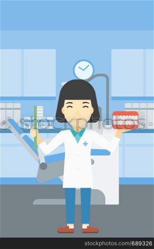 An asian young female dentist holding dental jaw model and a toothbrush in doctor office. Female dentist showing dental jaw model and toothbrush. Vector flat design illustration. Vertical layout.. Dentist with dental jaw model and toothbrush.