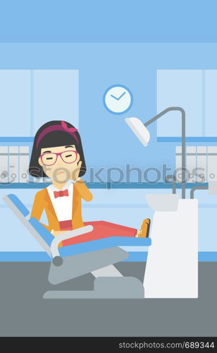 An asian young female patient sitting in dental chair at dentist office. Sad woman suffering from tooth pain. Woman having a toothache. Vector flat design illustration. Vertical layout.. Woman suffering in dental chair.