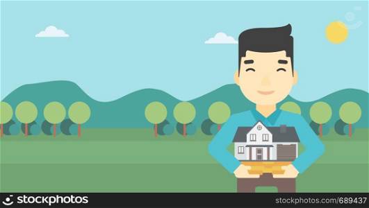 An asian young man holding house model in hands on the background of mountains. Real estate agent with house model. Vector flat design illustration. Horizontal layout.. Man holding house model vector illustration.