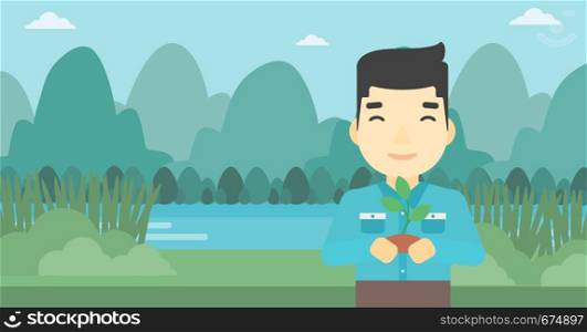 An asian young man holding in hands a small plant in soil on the background of landscape with mountains and river. Vector flat design illustration. Horizontal layout.. Man holding plant vector illustration.