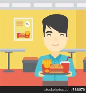 An asian young man holding tray full of junk food on a cafe background. Smiling man in fast food restaurant. Man having lunch in a fast food restaurant. Vector flat design illustration. Square layout.. Man with tray full of fast food.