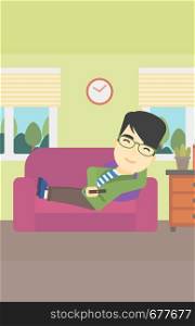 An asian young man lying on a sofa and watching tv with a remote control in his hand. Vector flat design illustration. Vertical layout.. Man lying on sofa vector illustration.