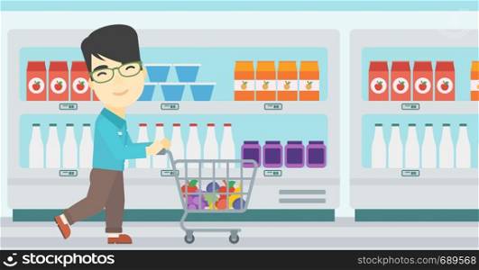 An asian young man pushing a supermarket cart with some goods in it. Customer shopping at supermarket with cart. Vector flat design illustration. Horizontal layout.. Customer with shopping cart vector illustration.