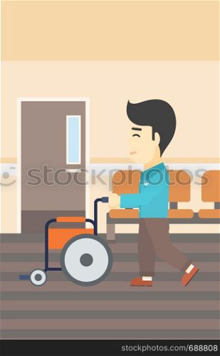 An asian young man pushing empty wheelchair on the background of hospital corridor. Vector flat design illustration. Vertical layout.. Man pushing wheelchair vector illustration.