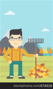 An asian young man raking autumn leaves. Man with rake standing near tree and heap of autumn leaves. Man tidying autumn leaves in garden. Vector flat design illustration. Vertical layout.. Man raking autumn leaves vector illustration.
