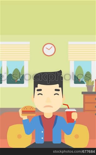 An asian young man sitting on a sofa while eating hamburger and drinking soda on the background of living room. Vector flat design illustration. Vertical layout.. Man eating hamburger vector illustration.