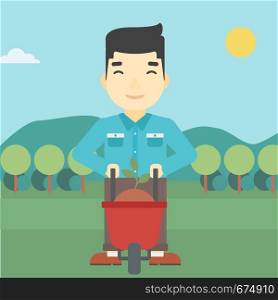 An asian young man standing with a plant and soil in a wheelbarrow on the background of mountain landscape. Vector flat design illustration. Square layout.. Man with plant and wheelbarrow.